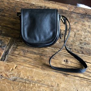 Fossil black fold over crossbody good hardware